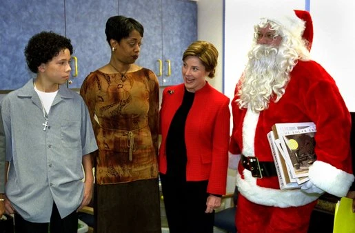 Laura Bush visits with D.C. sniper survivor Iran Brown in D.C. (12 December 2002).jpg