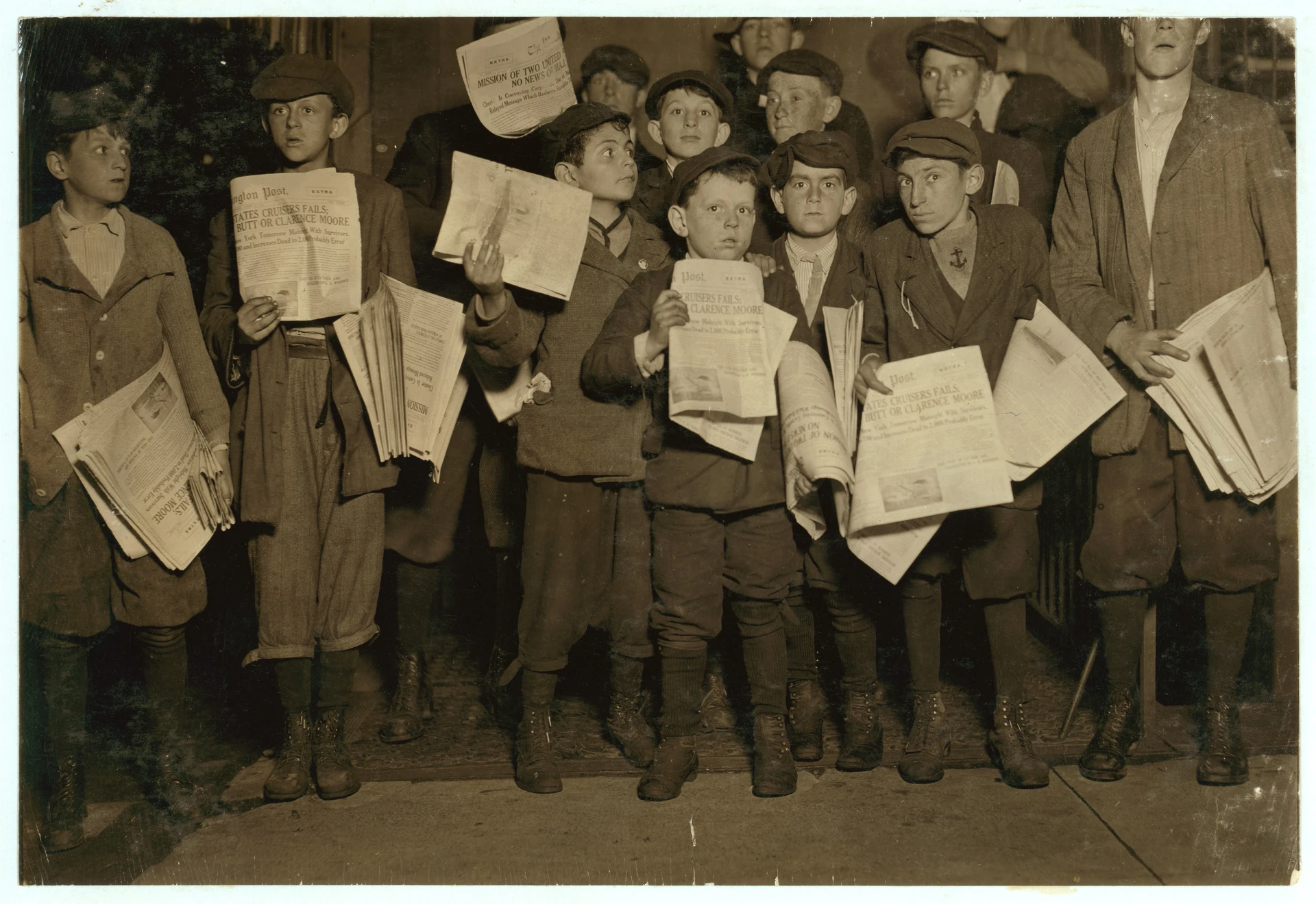After midnight April 17, 1912, and still selling extras. There were many of these groups of young news-boys selling very late these nights. Youngest boy in the group is Israel Spril (9 yrs. LOC cph.3b08442.jpg