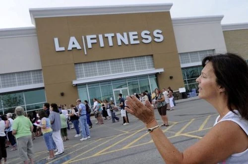 Mourners gather outside the LA Fitness in Bridgeville,Pa., in August...